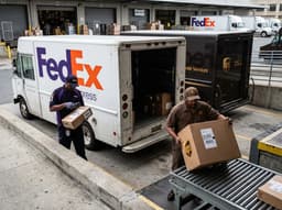 A courier holding packages, illustrating FedEx versus UPS.